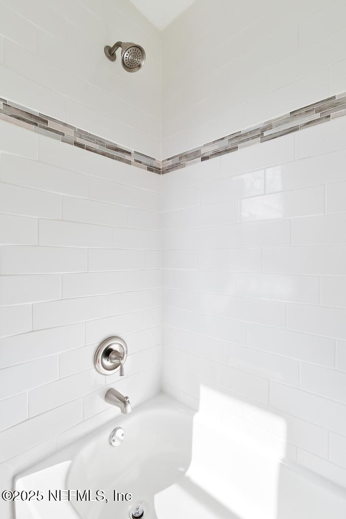 54074 Charles Street Callahan, FL 32011 - Photo 20 of 52 a bathroom with a shower and a bathtub