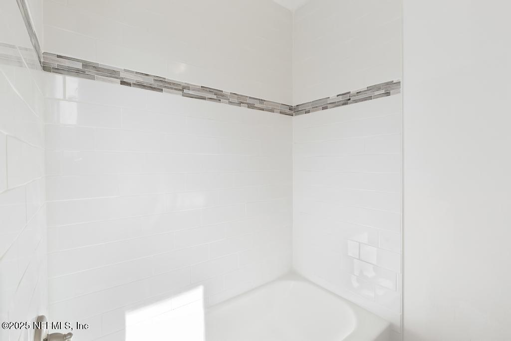 54074 Charles Street Callahan, FL 32011 - Photo 21 of 52 a bathroom with a shower