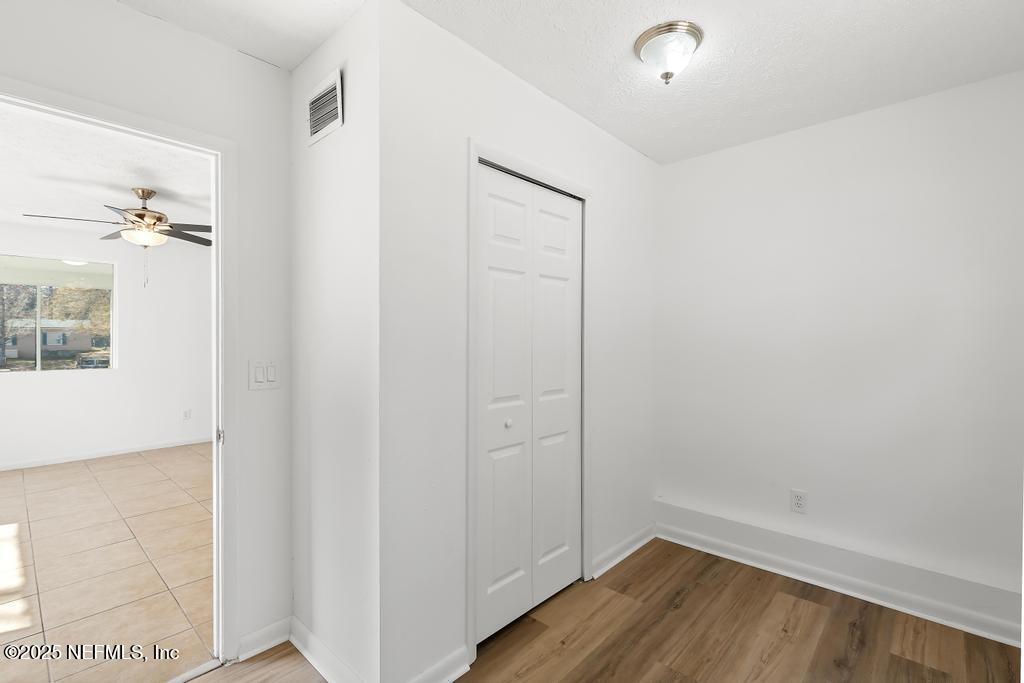 54074 Charles Street Callahan, FL 32011 - Photo 22 of 52 a view of a hallway with wooden floor
