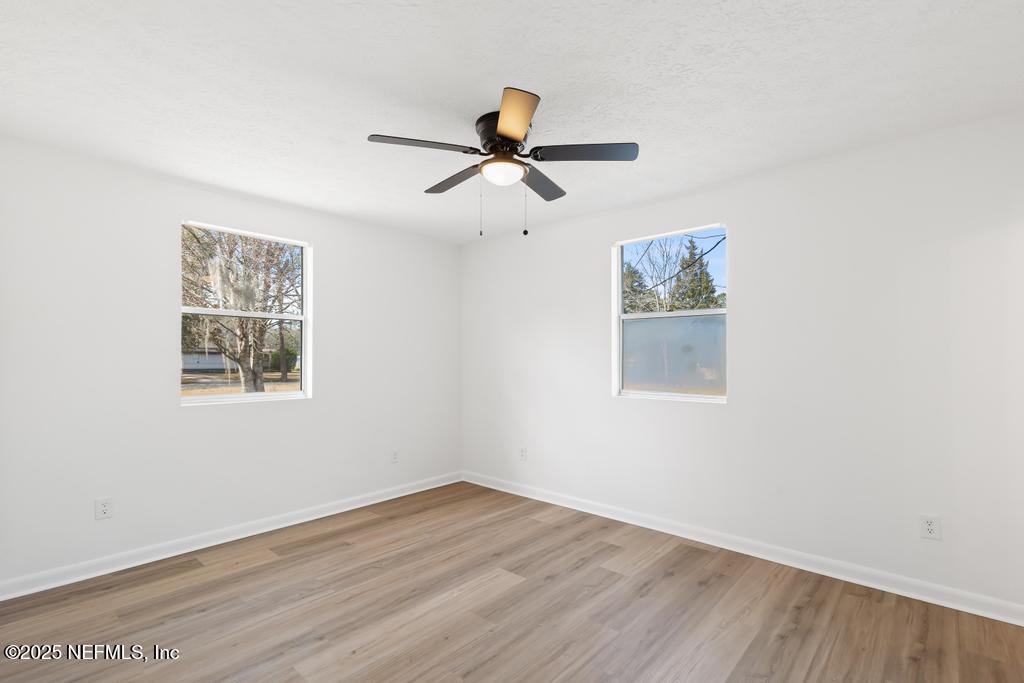 54074 Charles Street Callahan, FL 32011 - Photo 34 of 52 a view of empty room with wooden floor