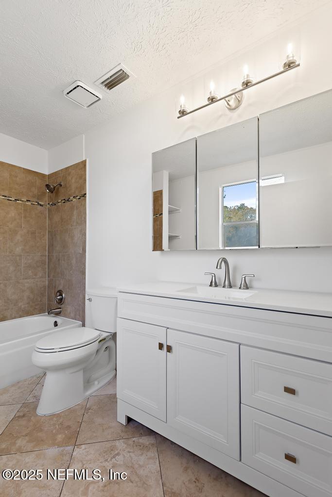 54074 Charles Street Callahan, FL 32011 - Photo 38 of 52 a bathroom with a sink a toilet and mirror