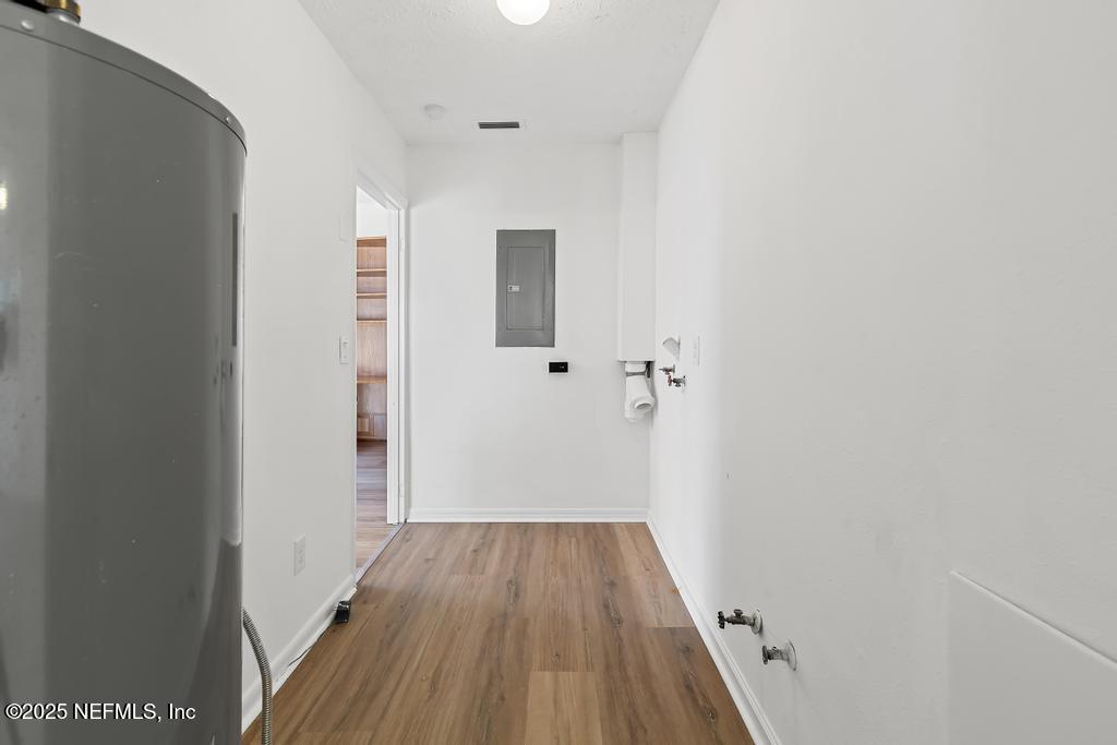 54074 Charles Street Callahan, FL 32011 - Photo 41 of 52 a view of a hallway with wooden floor