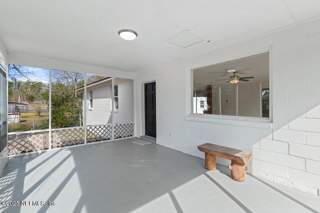 54074 Charles Street Callahan, FL 32011 - Photo 9 of 52 a living room with furniture and a window