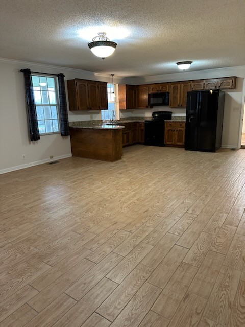169 Maxwell Branch Road Cottontown, TN 37048 - Photo 11 of 31 a living room with stainless steel appliances kitchen island granite countertop a refrigerator stove and sink
