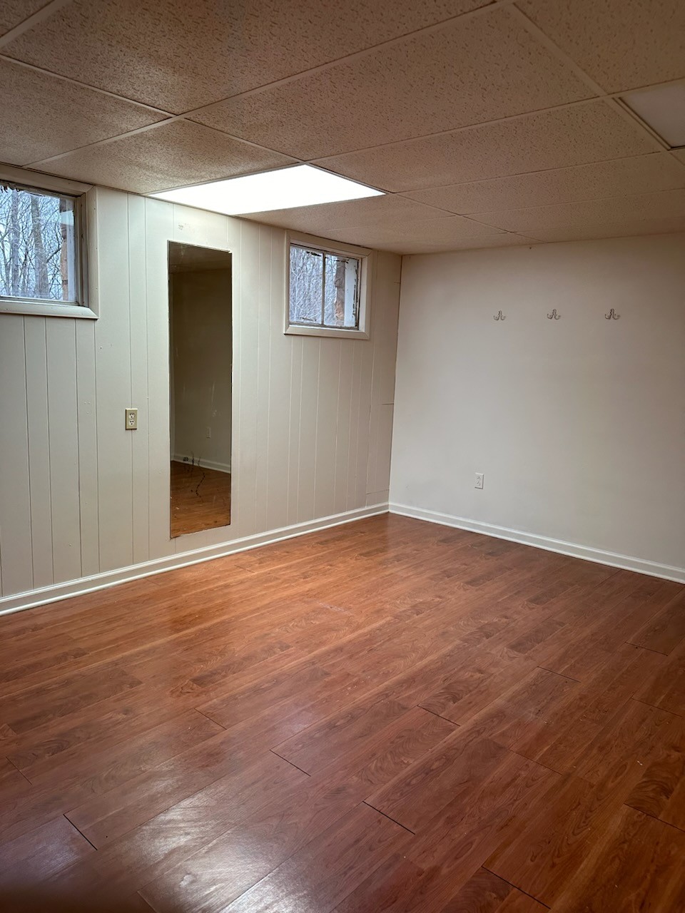 169 Maxwell Branch Road Cottontown, TN 37048 - Photo 21 of 31 a view of an empty room with wooden floor and a window