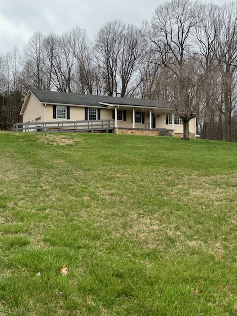 169 Maxwell Branch Road Cottontown, TN 37048 - Photo 4 of 31 a front view of house with yard and green space