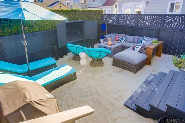 a view of a patio with a table and chairs