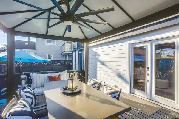 a kitchen with a refrigerator and a dining table