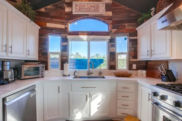 a room with wooden floor and furniture