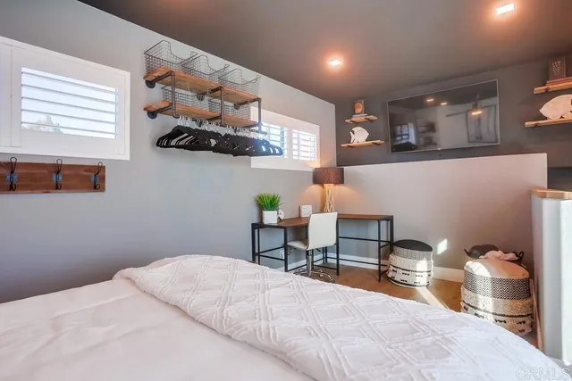 a view of a house with pool and chairs