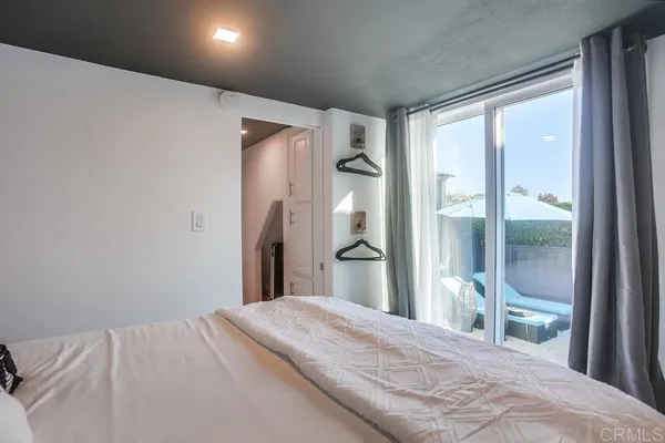 a aerial view of a house with swimming pool and furniture
