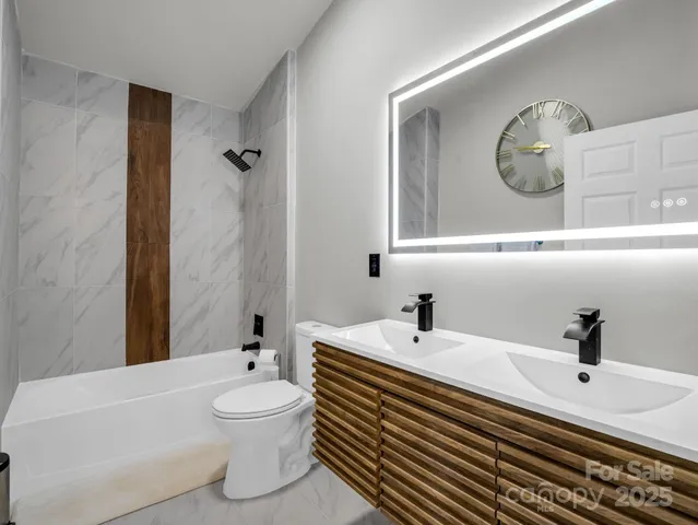 a bathroom with a sink a toilet and a bathtub