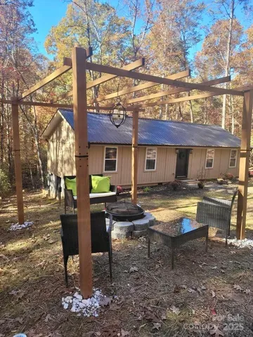 a swimming pool view with a outdoor seating