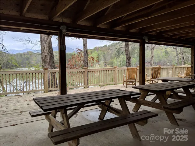 a view of a balcony with furniture and wooden floor