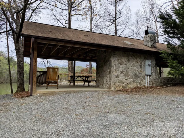 a view of a chair and table under an umbrella