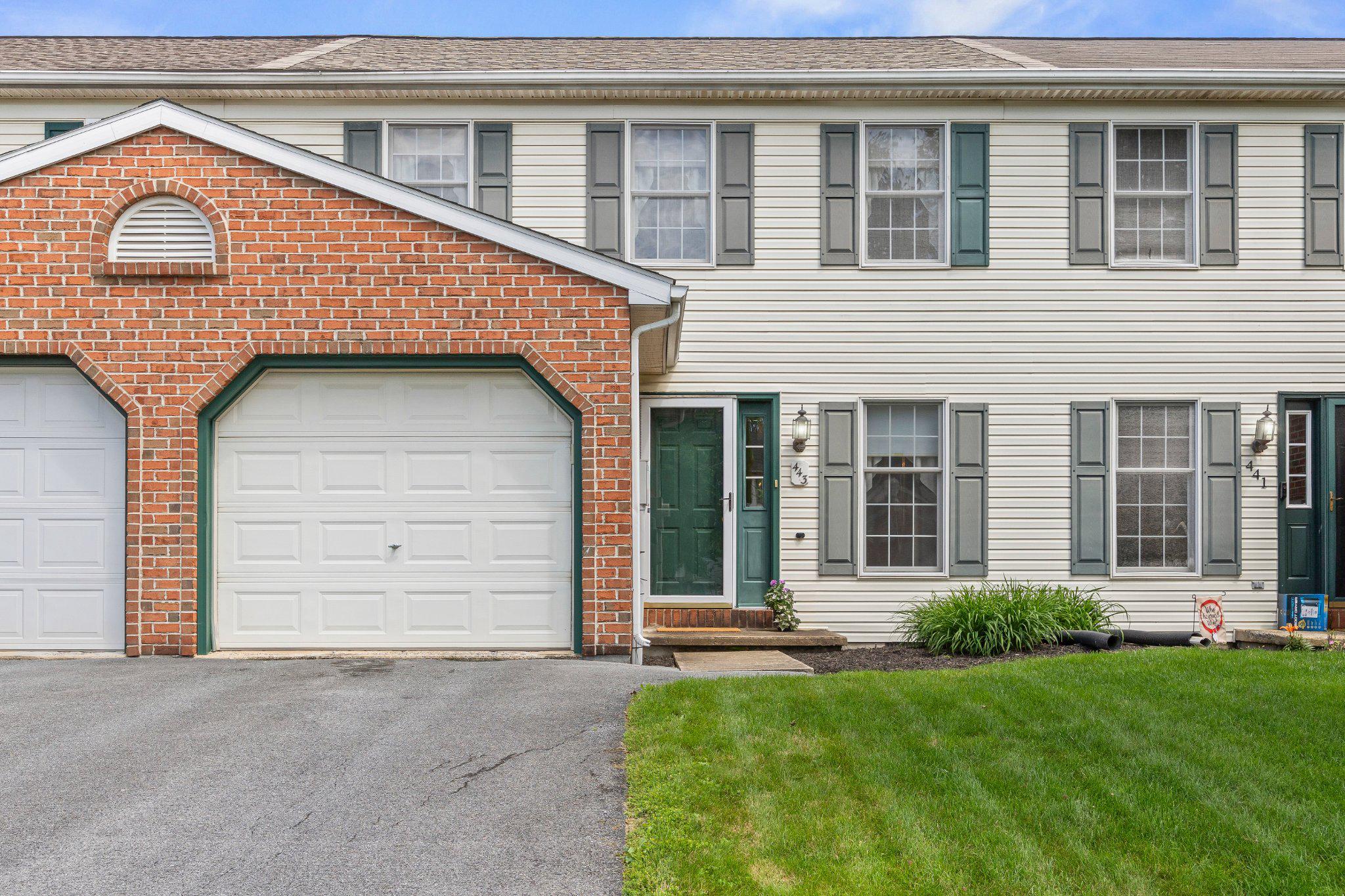 443 Crosswinds Drive Lititz, PA 17543 - Photo 2 of 26 a front view of a house with a garden