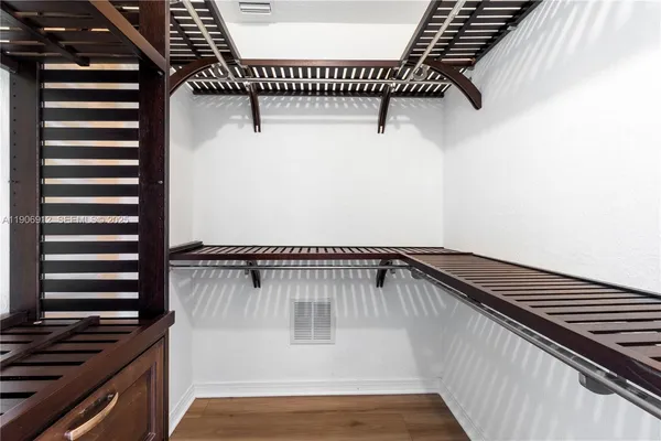 a view of a swimming pool and wooden floor