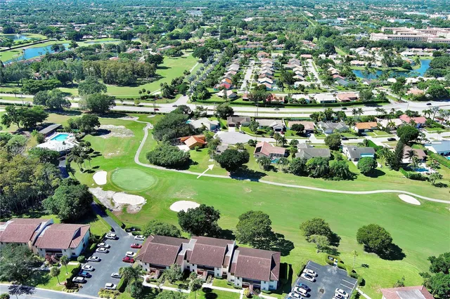 aerial view of a house with yard and furniture