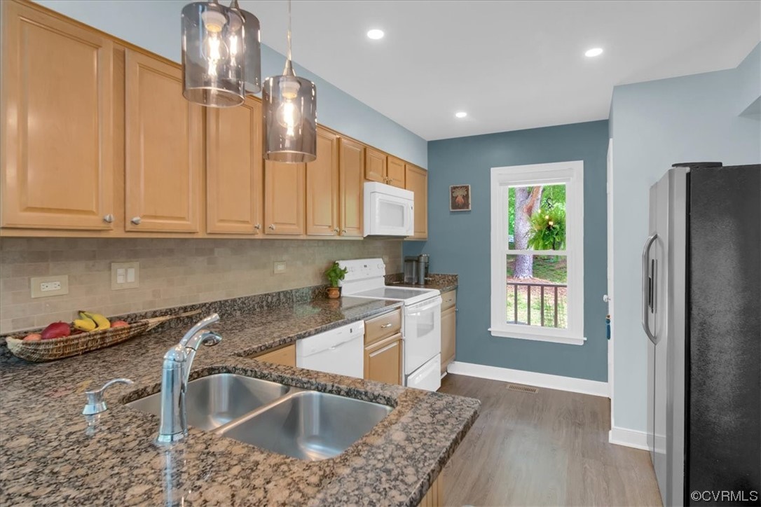 7121 Pointer Ridge Road Midlothian, VA 23112 - Photo 19 of 50 a kitchen with granite countertop a sink stainless steel appliances and cabinets