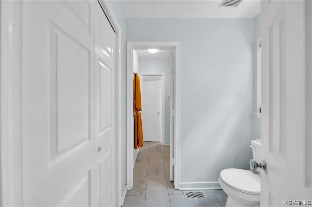 7121 Pointer Ridge Road Midlothian, VA 23112 - Photo 30 of 50 a bathroom with a granite countertop sink and a toilet