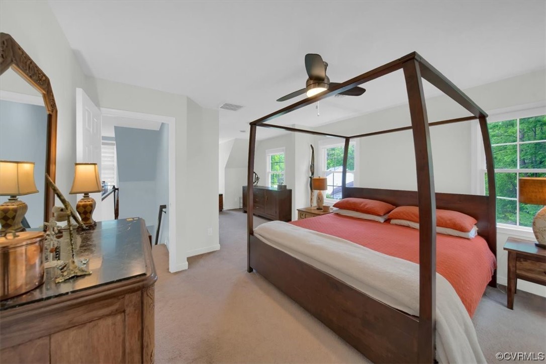 7121 Pointer Ridge Road Midlothian, VA 23112 - Photo 38 of 50 a bedroom with a bed and a mirror