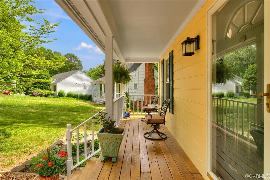 7121 Pointer Ridge Road Midlothian, VA 23112 - Photo 9 of 50 a view of a balcony with chair and wooden floor