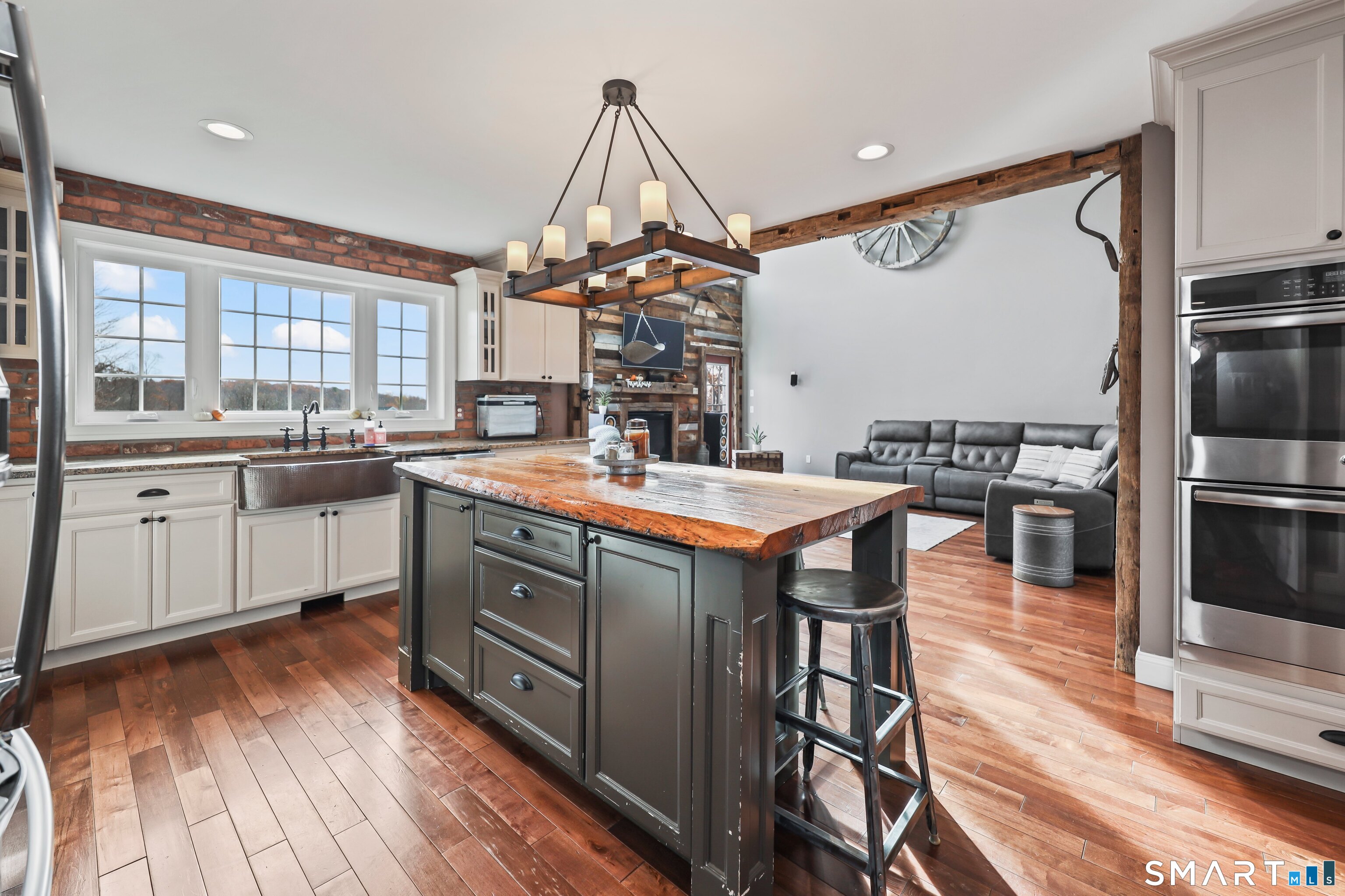 195 Hinman Road Watertown, CT 06795 - Photo 13 of 39 a kitchen with stainless steel appliances granite countertop a sink a stove and a refrigerator