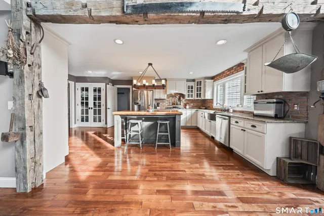 a large kitchen with lots of counter space and appliances