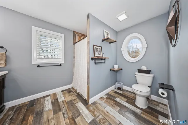 a bathroom with a toilet and a sink