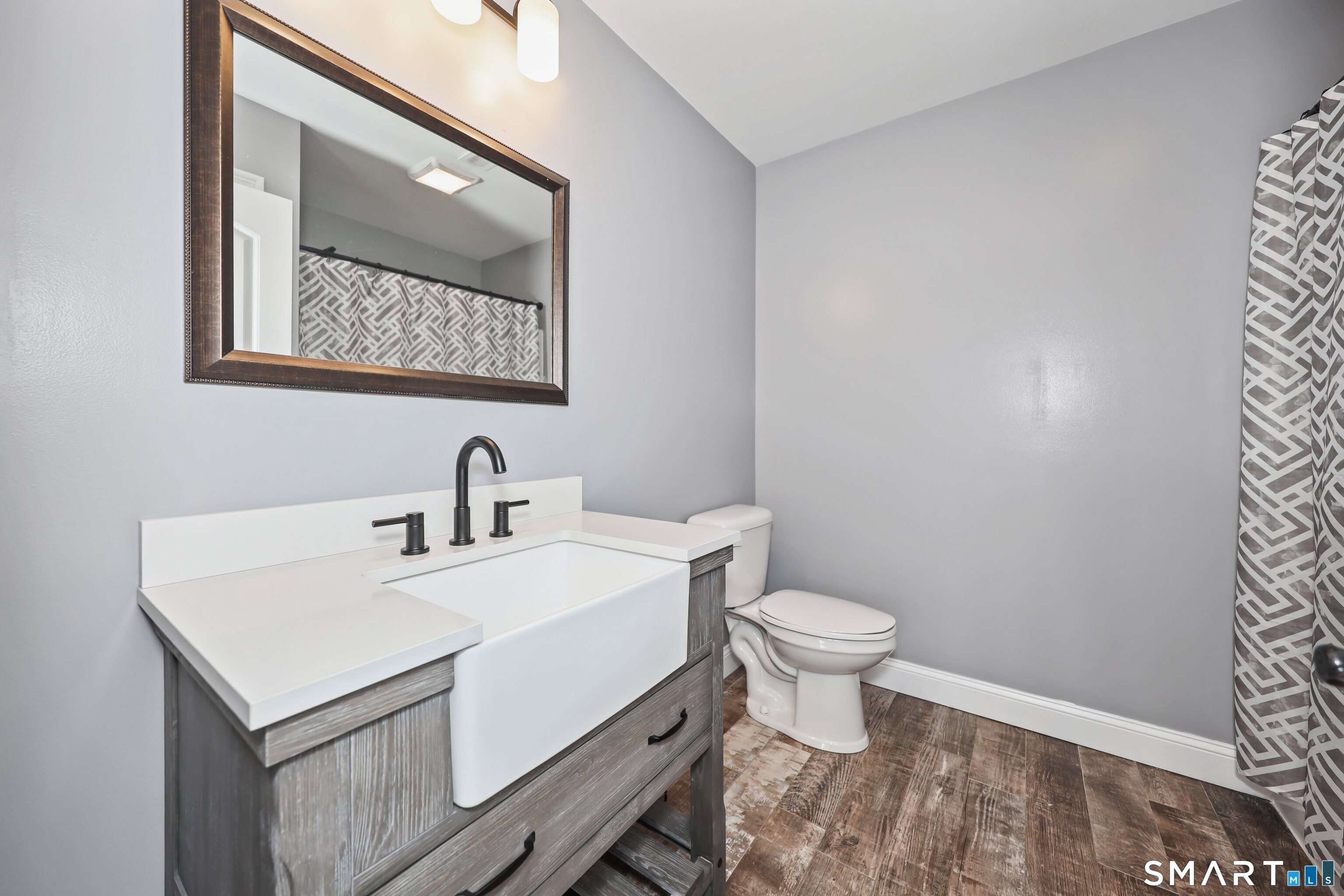 195 Hinman Road Watertown, CT 06795 - Photo 29 of 39 a bathroom with a toilet a sink and mirror