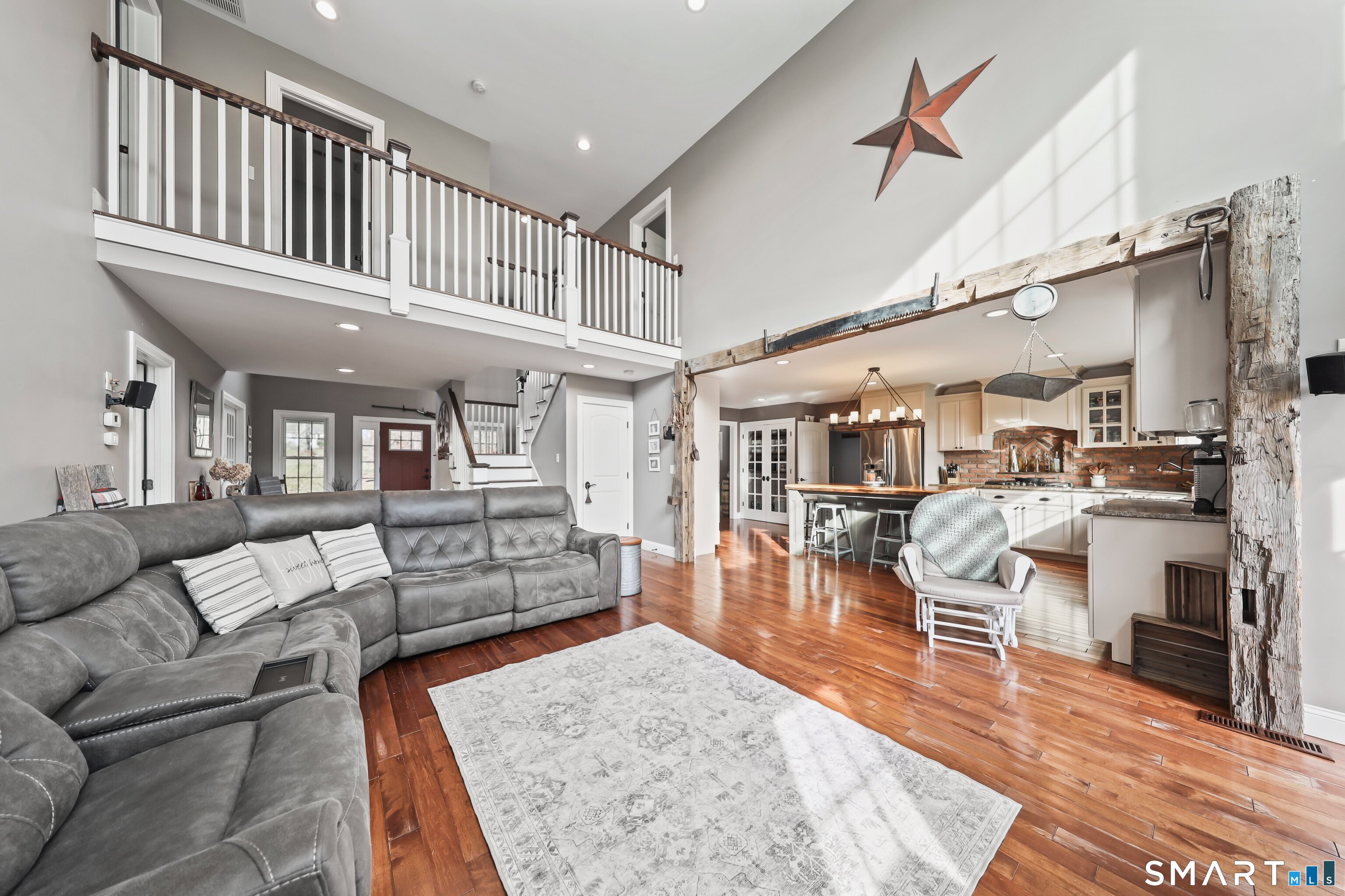 195 Hinman Road Watertown, CT 06795 - Photo 8 of 39 a living room with furniture and a wooden floor