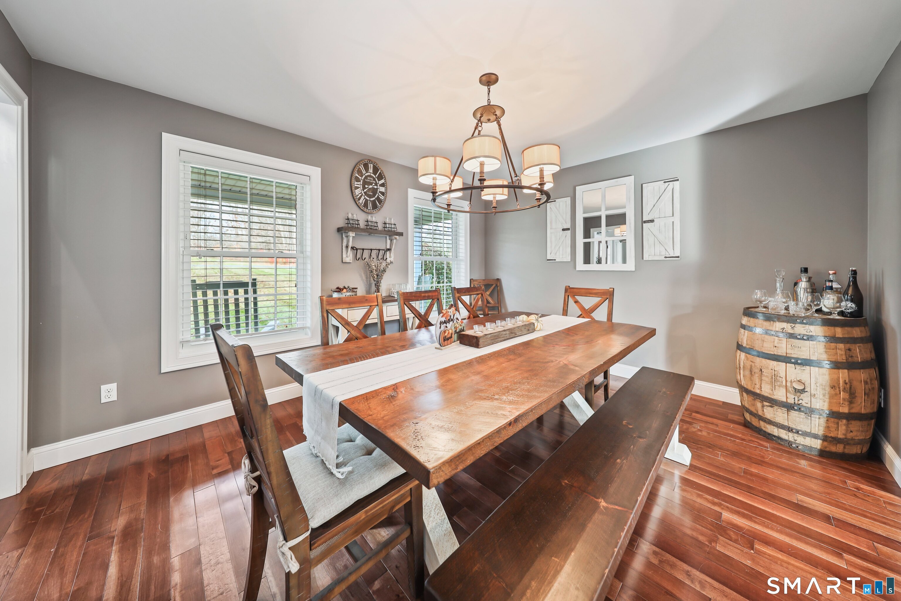 195 Hinman Road Watertown, CT 06795 - Photo 10 of 39 a view of a dining room with furniture a chandelier and wooden floor