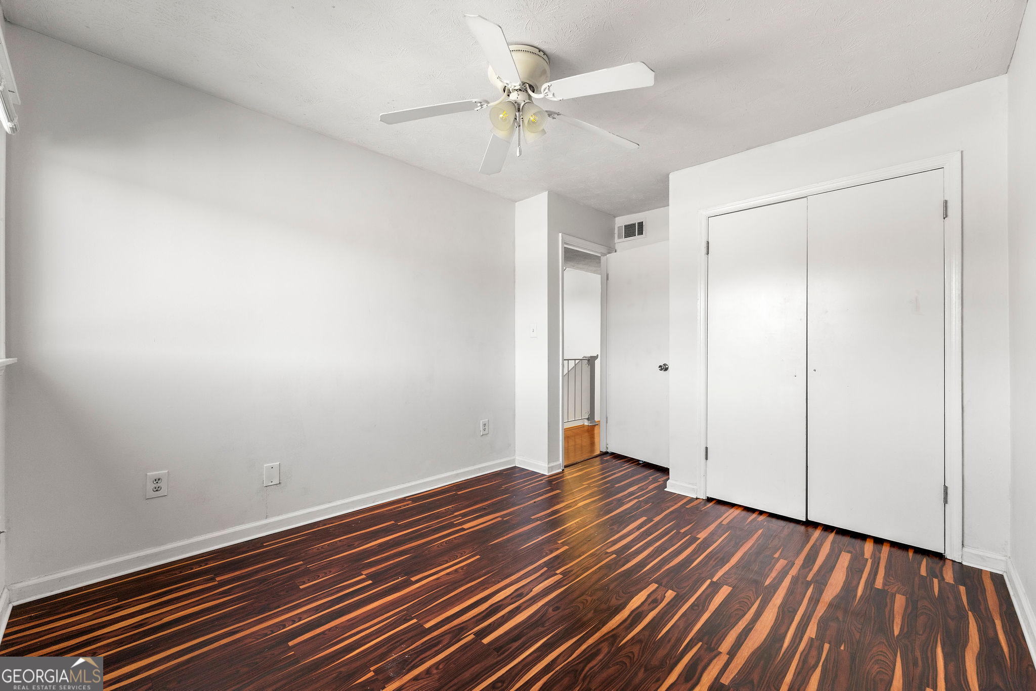 1820 Ashborough Road Southeast, Unit B Marietta, GA 30067 - Photo 16 of 21 a view of an empty room with wooden floor