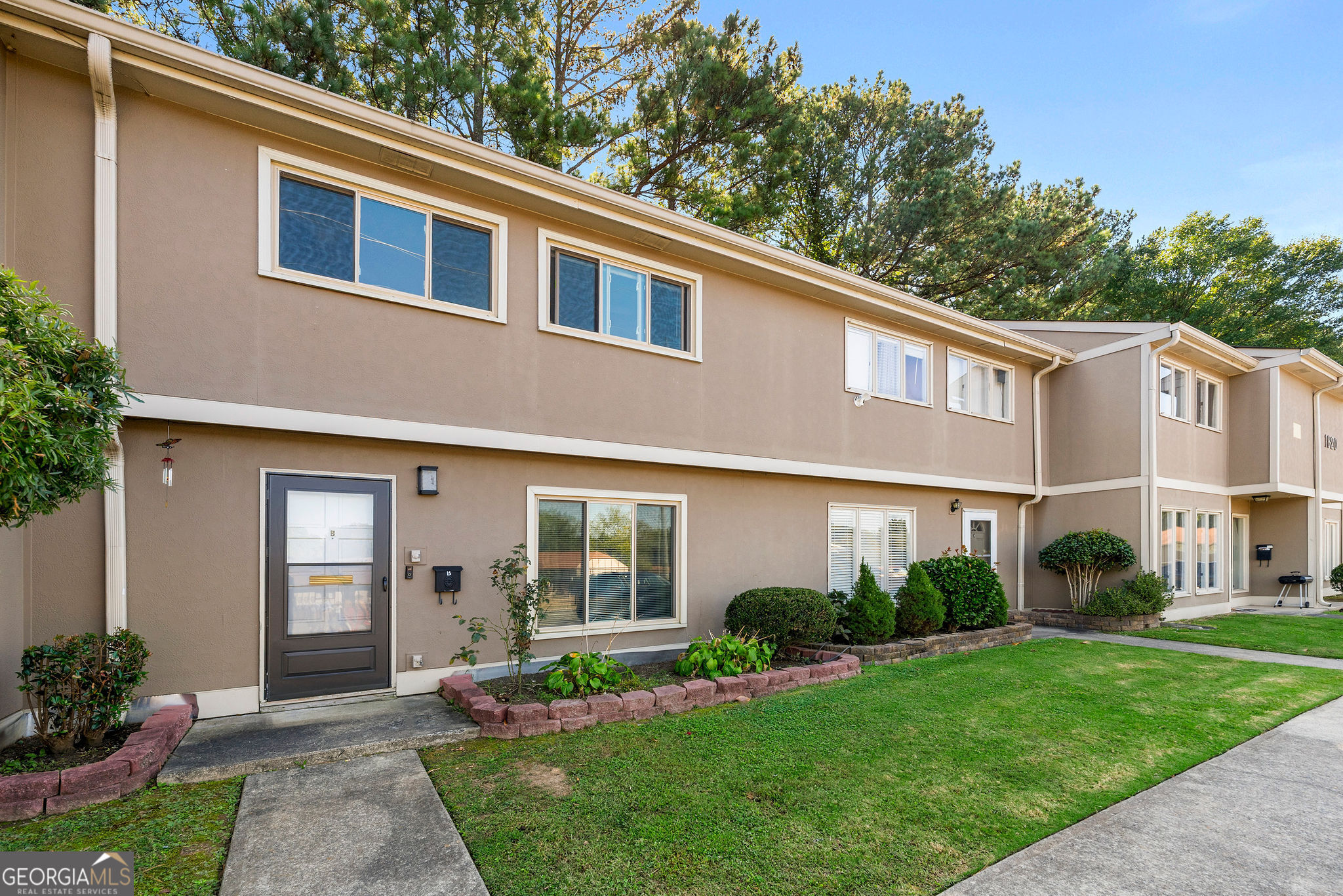 1820 Ashborough Road Southeast, Unit B Marietta, GA 30067 - Photo 3 of 21 a front view of a house with garden