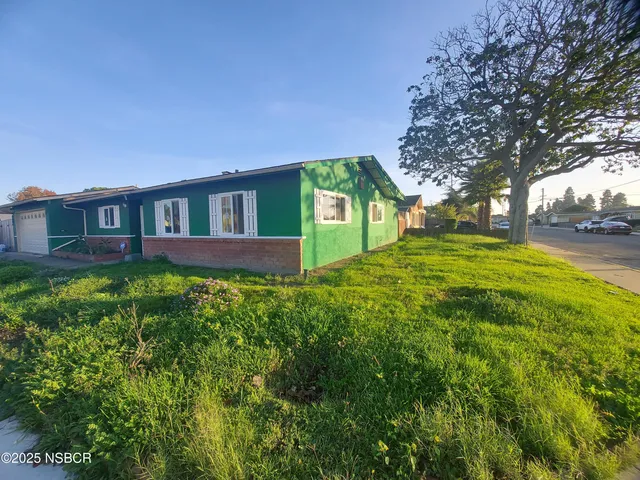 a house view with a garden space