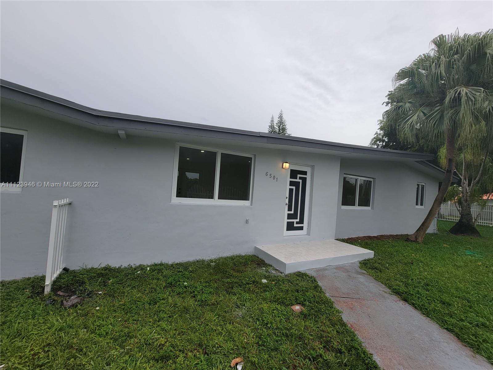 6501 Southwest 34th Street Miami, FL 33155 - Photo 1 of 62 a house view with a garden space
