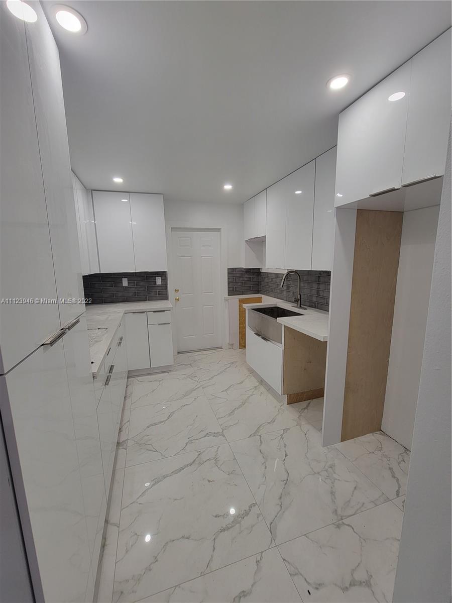 6501 Southwest 34th Street Miami, FL 33155 - Photo 13 of 62 a kitchen with stainless steel appliances a refrigerator sink and microwave