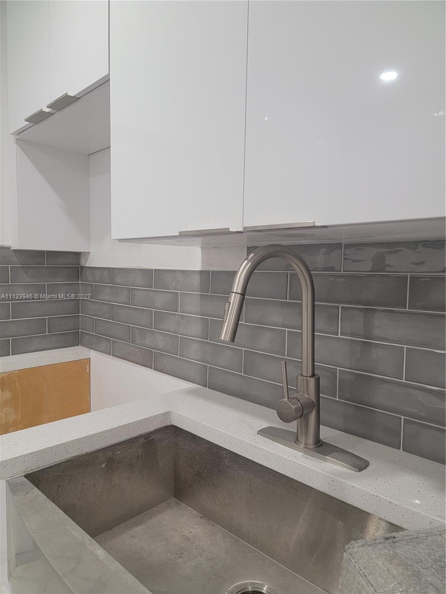6501 Southwest 34th Street Miami, FL 33155 - Photo 21 of 62 a bathroom with a sink and bathtub