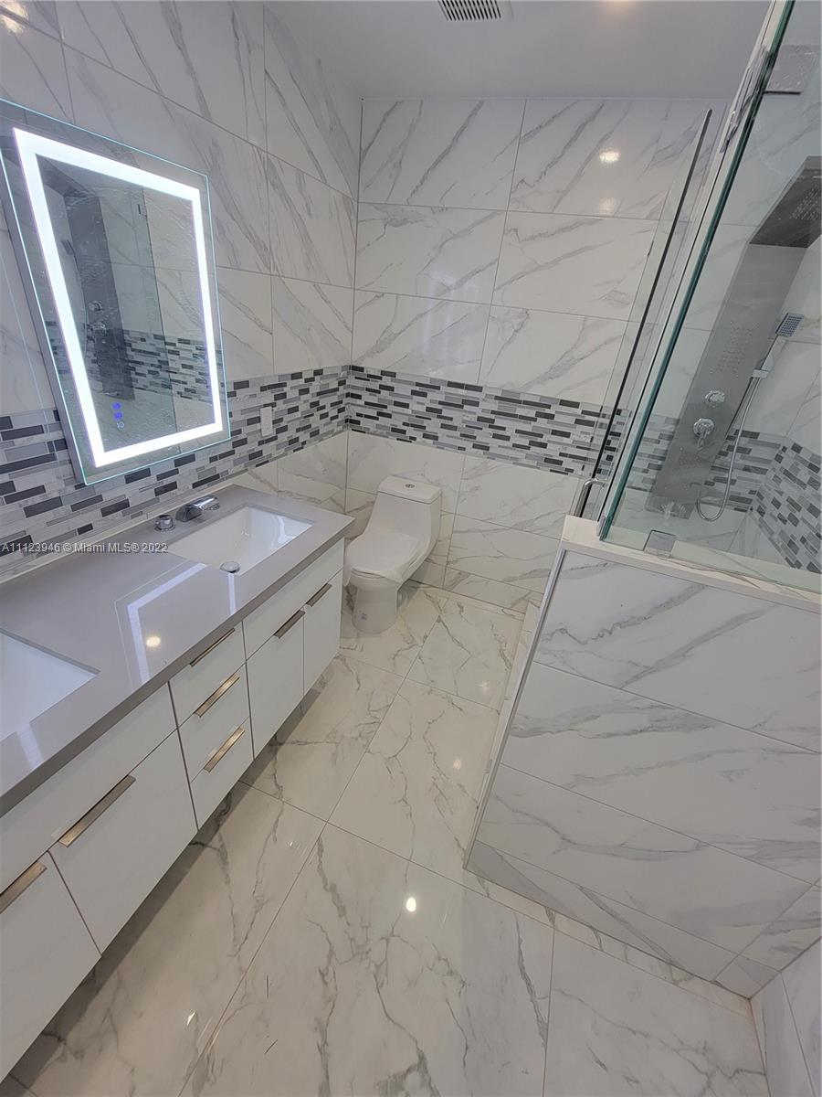 6501 Southwest 34th Street Miami, FL 33155 - Photo 29 of 62 a bathroom with a sink and a mirror