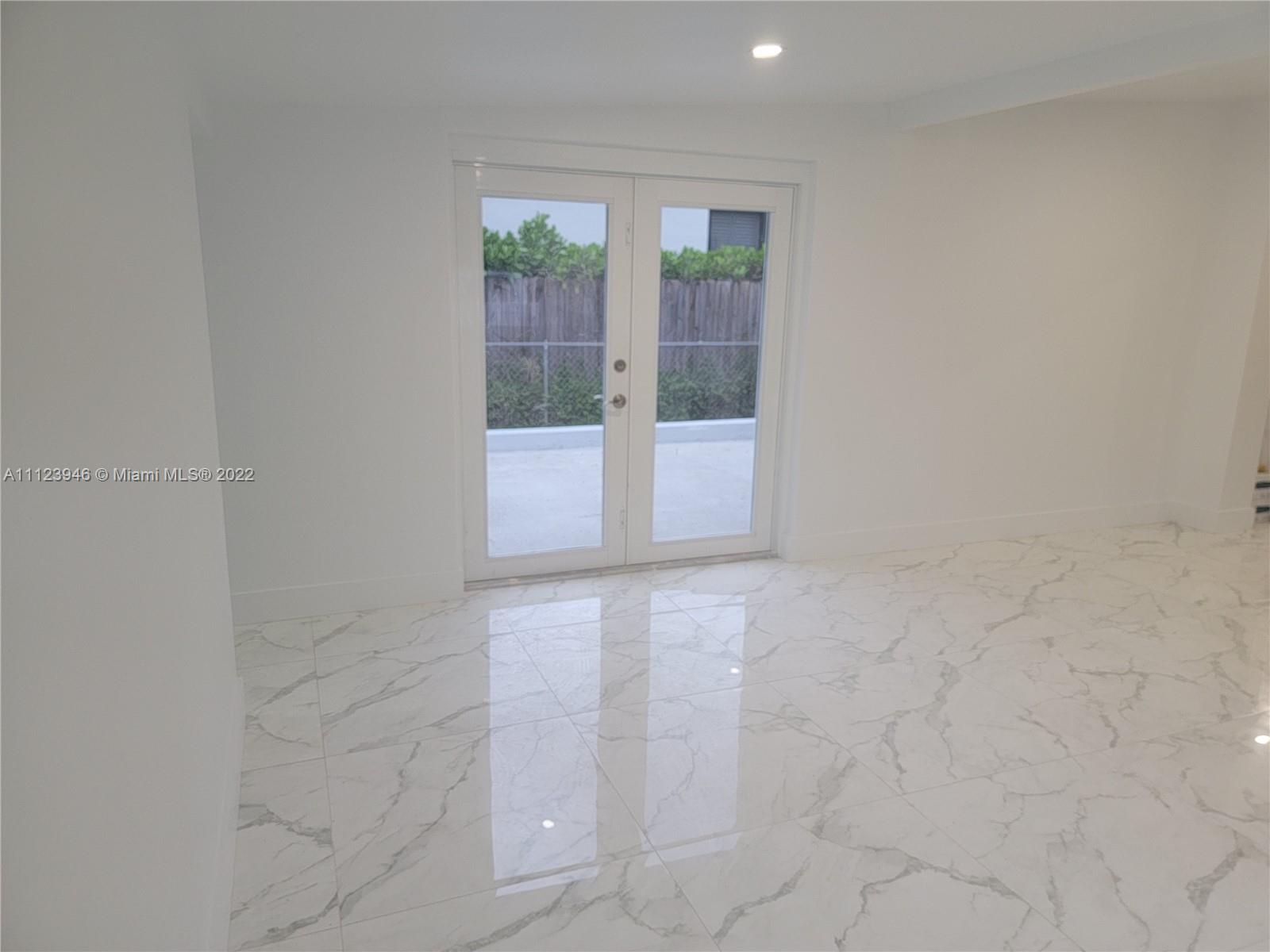 6501 Southwest 34th Street Miami, FL 33155 - Photo 42 of 62 a view of an empty room with glass door