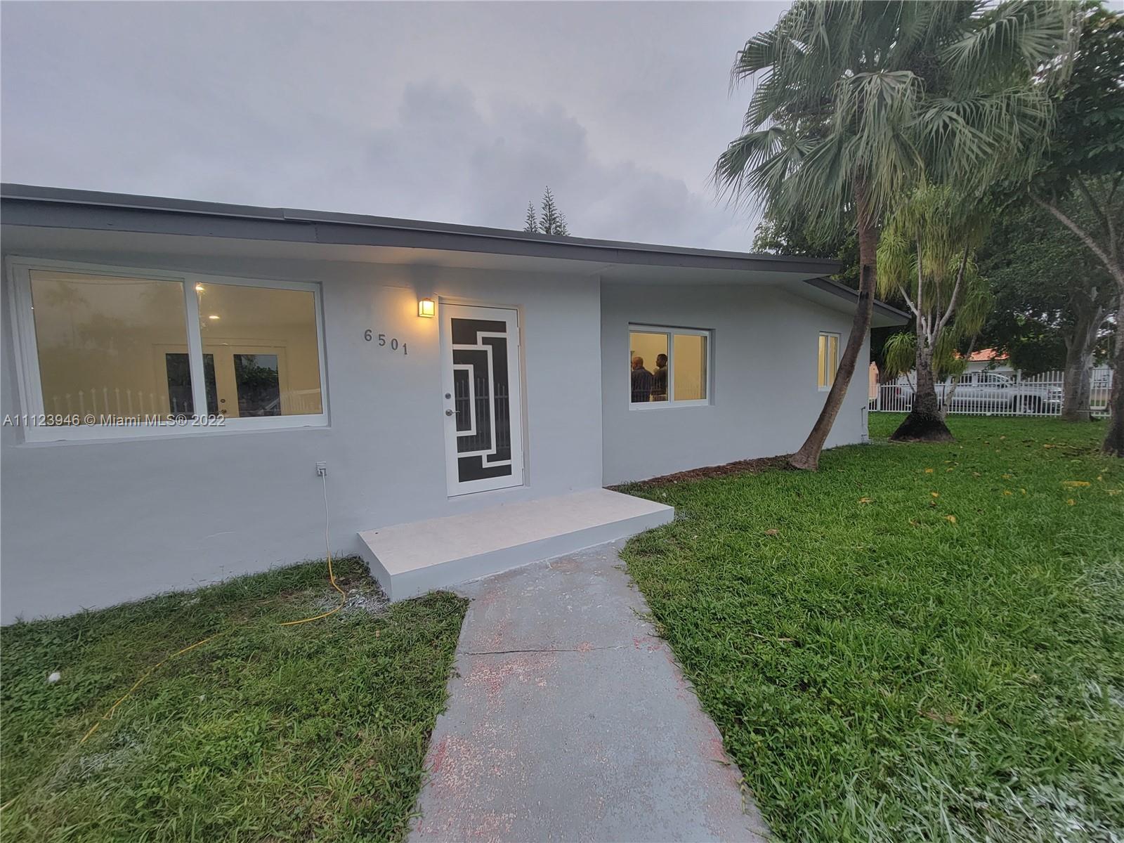 6501 Southwest 34th Street Miami, FL 33155 - Photo 6 of 62 a front view of a house with garden