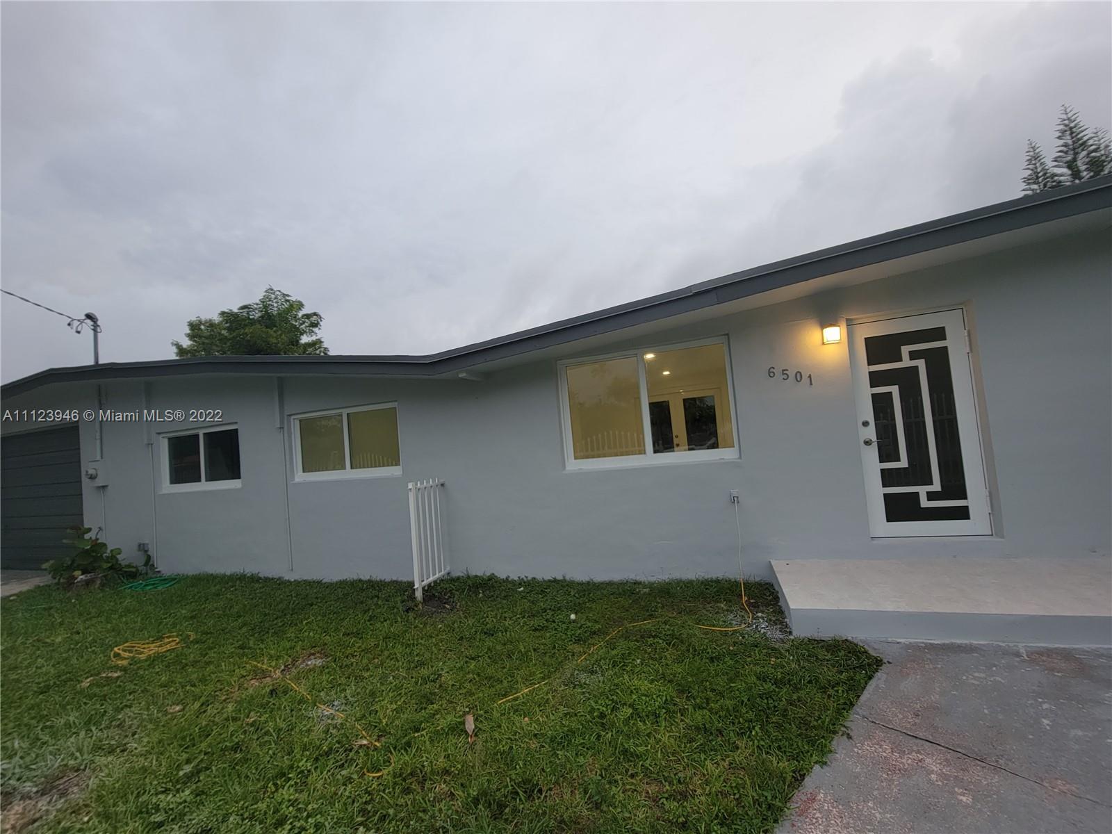 6501 Southwest 34th Street Miami, FL 33155 - Photo 7 of 62 a front view of a house with garden