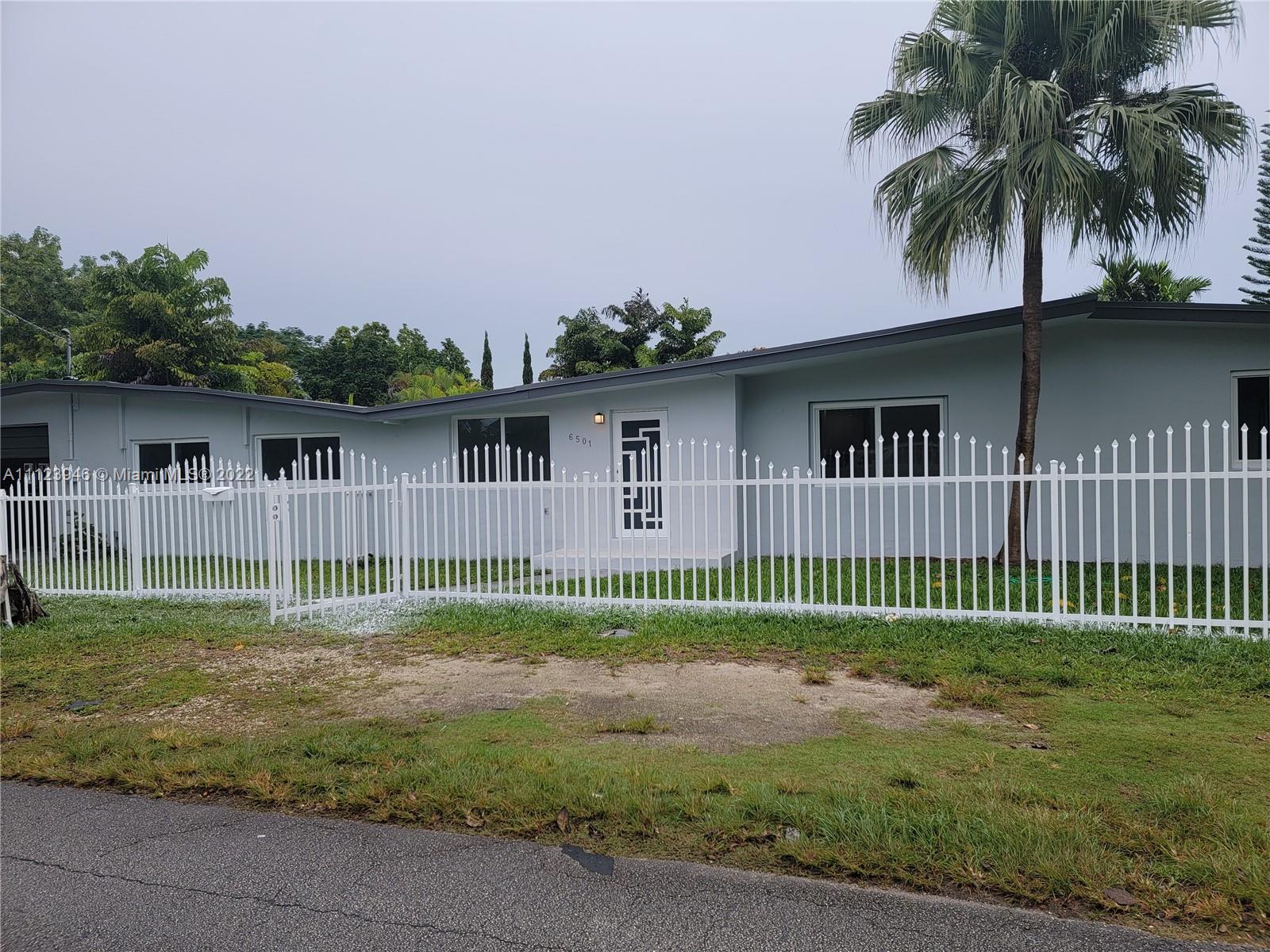 6501 Southwest 34th Street Miami, FL 33155 - Photo 10 of 62 a view of house with a big yard and plants