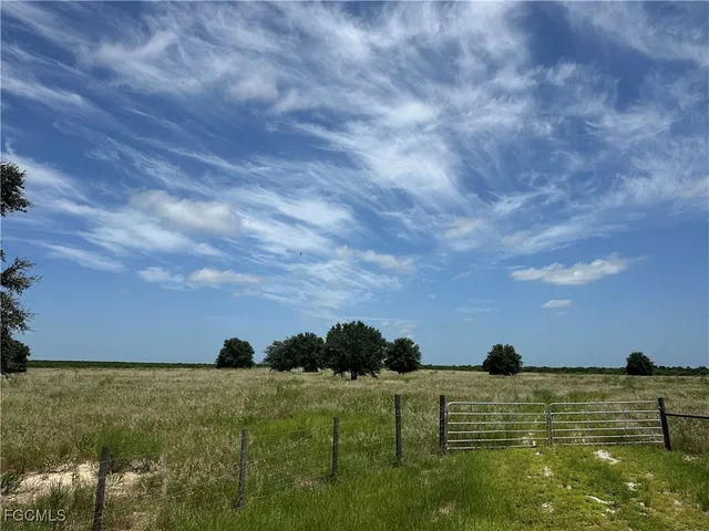a view of an ocean beach and mountain
