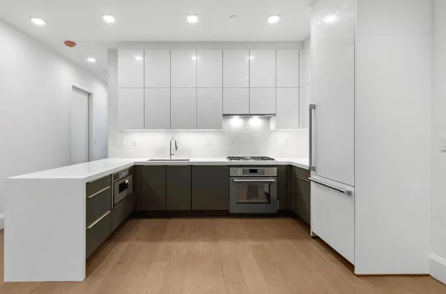 a picture of a bathroom with a shower