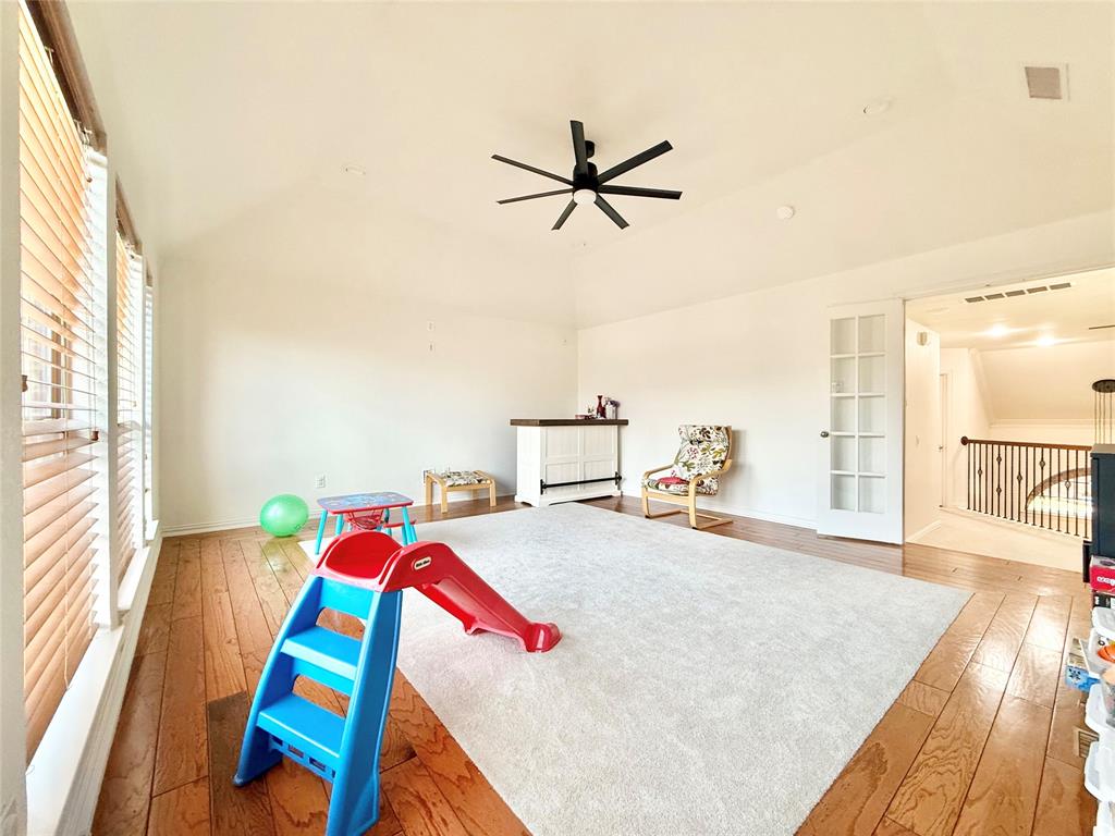 2754 Ridge View Road Frisco, TX 75034 - Photo 28 of 34 a bed room with a bed window and a kitchen view