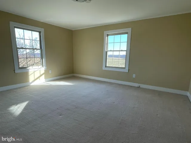 an empty room with windows