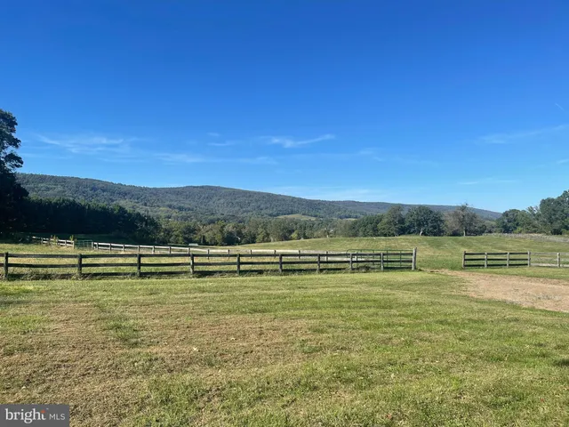 a view of a lake with houses in the back
