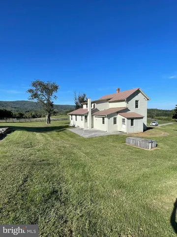 a view of a house with a big yard