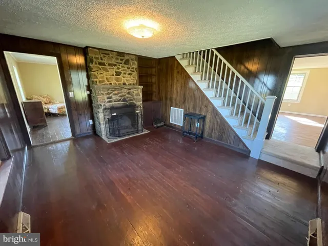 a view of an entryway with wooden floor